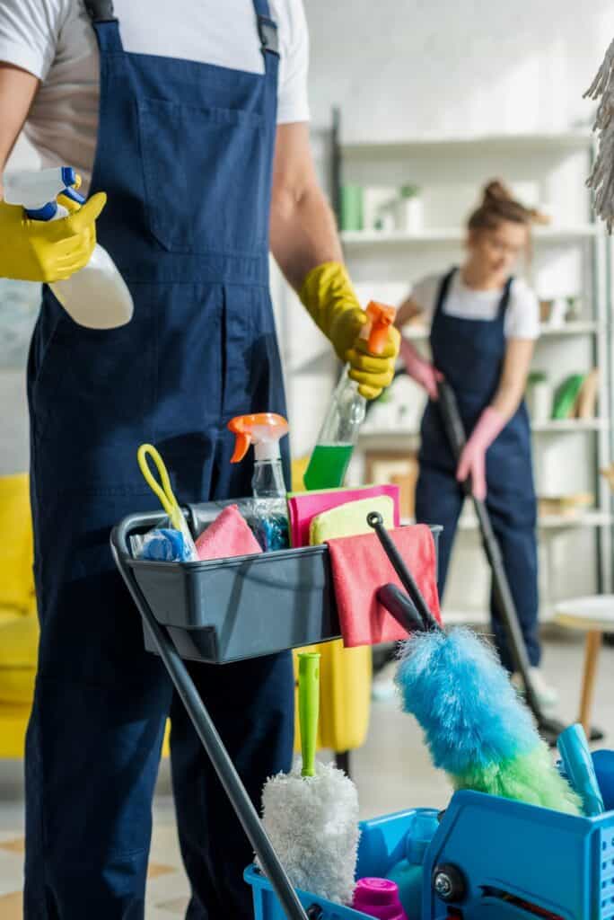 Cleaning team with a cleaning trolley